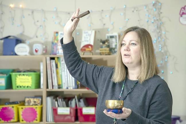 Warwick Valley Middle School teacher Diana Piascik with a Tibetan singing bowl in her classroom on Dec. 4, 2020.