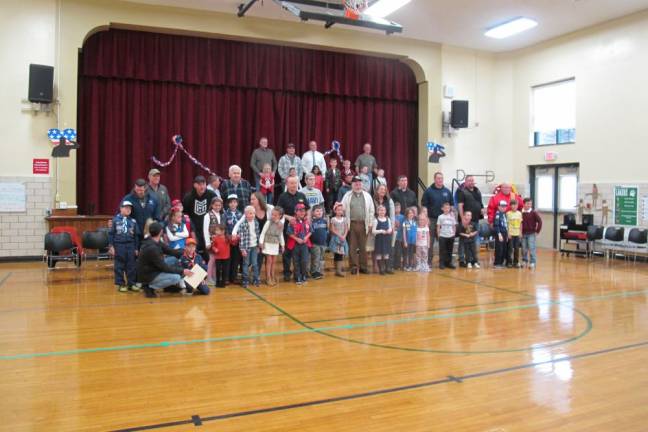 Veterans are pictured with their family members.