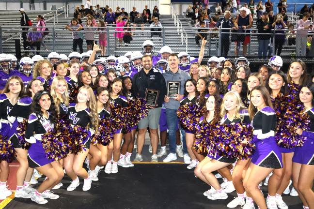 Warwick recognized John Garcia Jr., center left, and Johnny Babin, center right, the newest inductees into the Football Hall of Fame, prior to Friday night’s game.