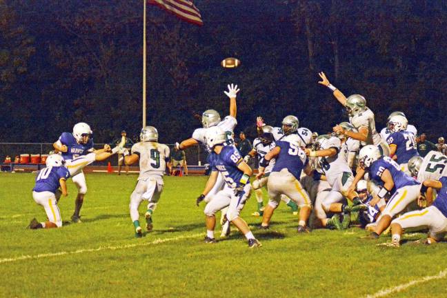 Photo by Al Konikowski As soon as Nick Garcia (10) got the ball down on the tee, Steven Mehling (6) kicked the game-winner against Minisink Valley as time expired.