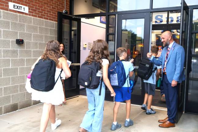 Seward Principal Michael Maesano greets students on the first day.