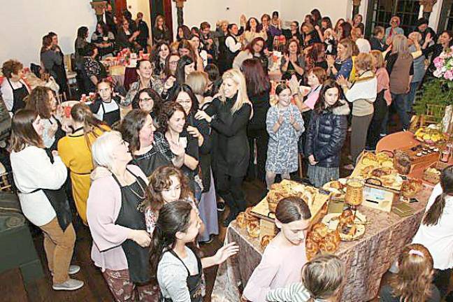 As the dough rose, participants danced and sang to lively music in celebration at Chabad’s Mega Challah Bake at the Rushmore Estate Ballroom.