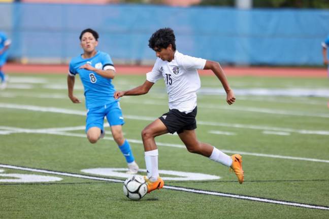 Crusader Siddharth Ranganathan #15, moves the ball up the field in the first half.