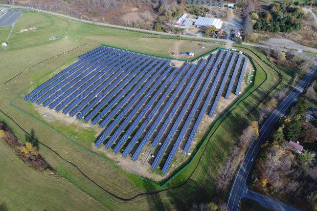 Provided photo Work on the 10-acre solar project began in July 2017. For the safety of students, and the protection of the solar panels, the project includes security cameras and fencing. Also, trees have been planted along Sanfordville Road to provide a visual barrier.
