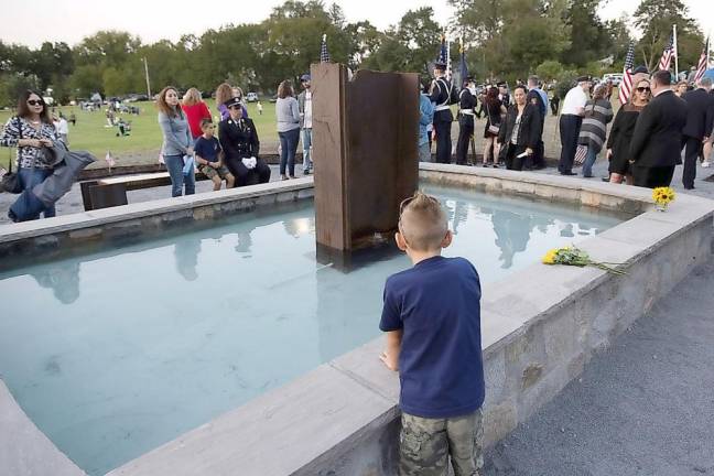 Warwick Mayor Michael Newhard described the Memorial Sculpture Garden as “a wonderful gift to the community to be located in an area where children play, easy to see but that stands apart high on a hill - a quiet place to teach the children what happened that day.” Photo by Robert G. Breese.