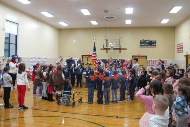 The students salute the veterans, which is followed by the Pledge of Allegiance.
