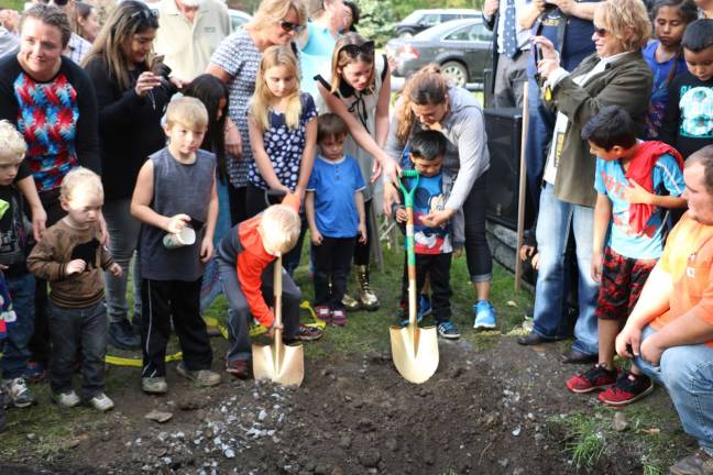 The young members of the new Board of Trustees were given ceremonial shovels and an opportunity to help complete the burial of the new Time Capsules until they also participate in the raising and opening 50 years from now.