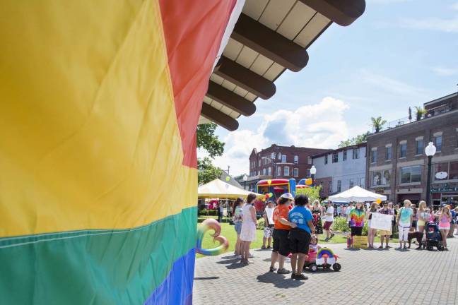 Best of 2014: A young man holds a sign that reads &#xfe;&#xc4;&#xfa;Lets Make Warwick A Safe Zone For All,&#xfe;&#xc4;&#xf9; one of the main messages of the first Gay Pride Parade in Orange County held on June 22 in the Village of Warwick. It was organized by the LGBTQ Center of the Warwick Valley, whose goals include building &#xfe;&#xc4;&#xfa;a bridge between the surrounding communities to facilitate and educate tolerance and respect,&#xfe;&#xc4;&#xfa;making all of our community a safe and healthy place to live and play.&#xfe;&#xc4;&#xf9; The second annual OC Pride weekend is scheduled for June 19-21. Photo by Robert G. Breese.