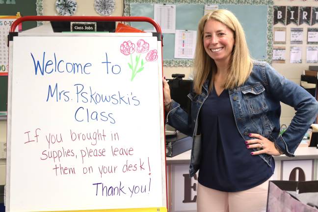 Angela Pskowski, who teaches first grade teacher at Chester Elementary School, welcomes students to class. Photo provided