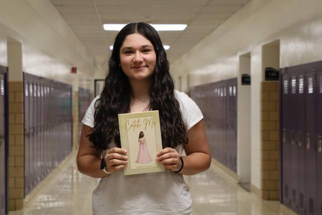 WVHS junior Isabella Costanza with her book, “Catch Me.”