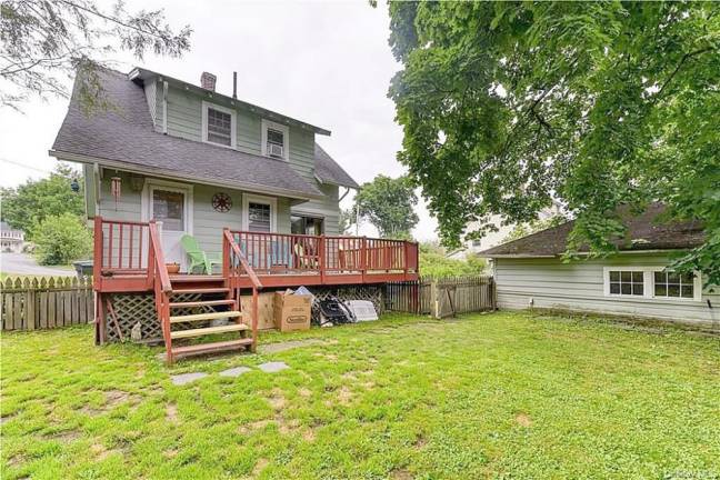 Charm and village convenience with quiet patio over fenced yard