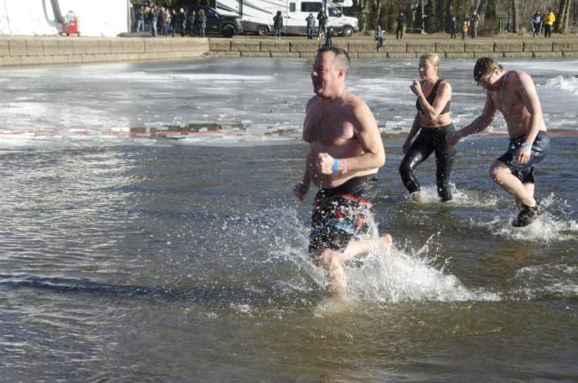 Thousands frolicked, some swam, at wintery carnival