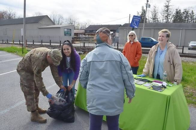 After dropping off unwanted mediation, Nydia Feldner talks to Warwick Valley Coalition members (from left) US National Guard Technical Sergeant Luis Giron, Coalition Coordinator Francesca Bryson, Director of Prevention Services Annie Colonna &amp; Judy Quackenbush.
