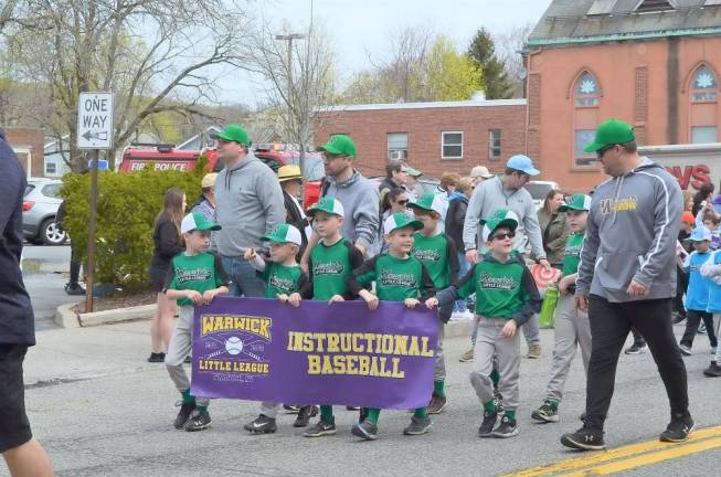 Warwick Little League boys march in opening day parade.