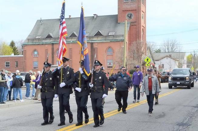 The Town of Warwick Police Department Color Guard (from left) – Officer Michael Mazzella, Sgt. Keith Slesinski, Officer Brian Siniscalchi, &amp; Officer Sean McNamara – lead the Warwick Little League Parade on Sat., Apr. 23, followed by Assemblyman Karl Brabenec and Mayor Michael Newhard.