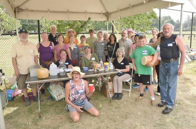 Warwick Mayor Michael Newhard, second row--third from right, and Too Good To Toss volunteers celebrated the return of the much-loved community recycle event to Stanley Deming Park for the first time in two years.