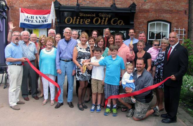On Friday, June 5, Town of Warwick Deputy Supervisor James Gerstner, Mayor Michael Newhard and members of the Warwick Valley Chamber of Commerce joined Chris and Diane Zimmerli and their partners and neighbors Arthur Baxter and Andrea Volter, their families, friends and staff for the official grand opening of the Warwick Valley Olive Oil Co. at 20 Railroad Ave.
