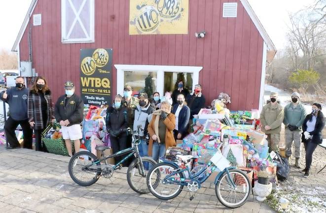 On Dec. 15, volunteers arranged toys outside for pick-up for the fifth annual Toys for Military Tots drive sponsored by Orange County Community Radio WTBQ. Photo by Roger Gavan.