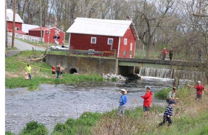 Take a Kid Fishing Day– It was great weather for fishing on Saturday, May 5, as close to 200 people, youngsters along with their parents or grandparents, came out to enjoy overcast skies and mild temperatures while fishing in a creek well stocked with trout.