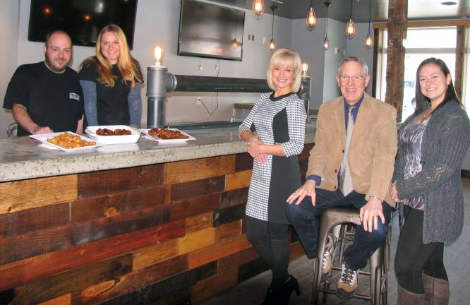 Photo by Roger Gavan Recapping plans for The Warwick Valley Chamber of Commerce Jan. 29 winter social at The Black Dirt Brewhouse Restaurant are, from left, chef Jay McLaughlin, owner Kristen Said, Warwick Valley Chamber of Commerce Event Planners Janine Dethmers and Kristen Weiss with Executive Director Michael Johndrow.