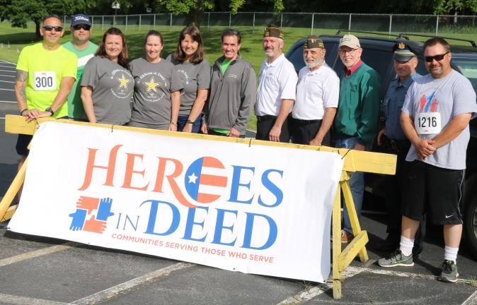 1. Attendees from left, Board members Peter Artusa, Treasurer Robert Bo Kennedy, Executive Director Liz Harman, Colonel Ketti Davison, Board President Laurie Courage, Rear Admiral John Kirby, John MacDonald, Carmine Garitano, Town of Warwick Supervisor Michael Sweeton, Warwick Police Department Lt. John Radar, and Orange County Legislator Paul Ruszkiewicz.