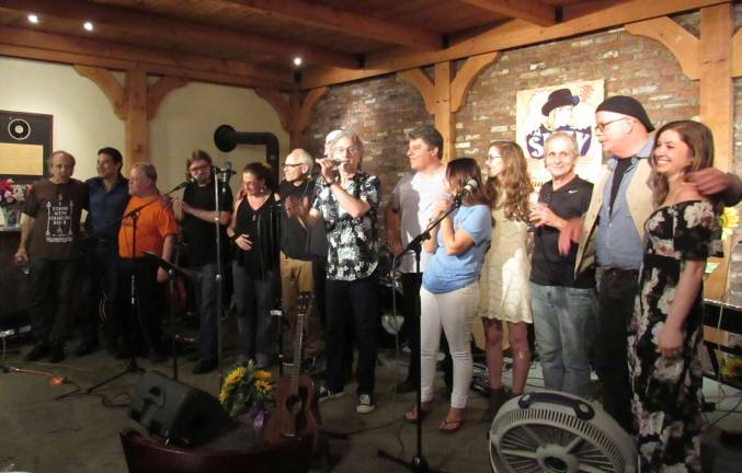 After hearing a recording of Suzy Arnowitz singing &quot;The Mountain,&quot; all of the musicians who participated in Suzy Fest gathered for a final bow.
