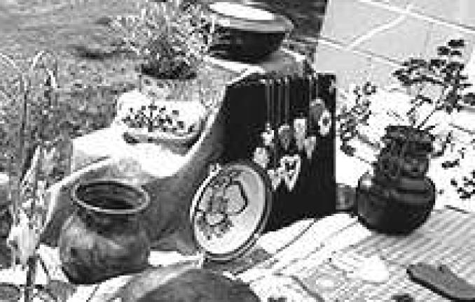 Pottery available at the Amity Pottery Workshop sale includes functional and wearable items.