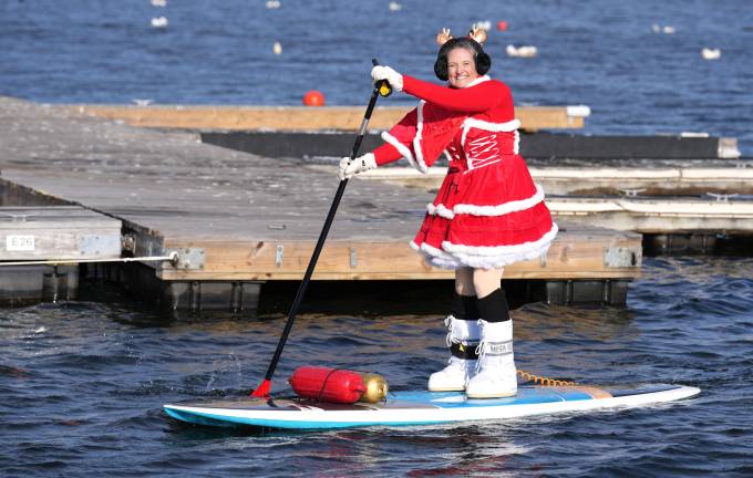Micki Michelle on the lake during the 12th Annual Greenwood Lake Santa Palooza Paddle. - to raise money and collect food for the local pantries. Organized by Micki Michelle and Dee Schmitz - Jersey Paddle Boards