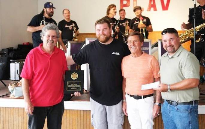 Pictured from left to right are Warwick Town Councilman Russ Kowal, onion eating contest winner Rob Gillespie, Polka King Jimmy Sturr and Orange County Legislator Paul Ruszkiewicz.