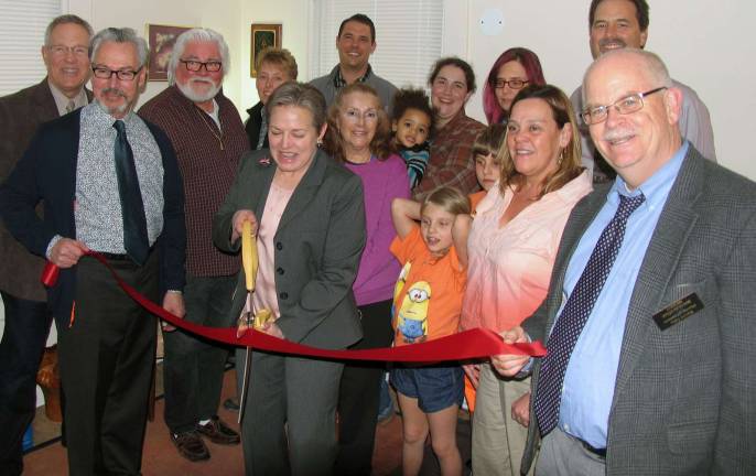 Photo by Roger Gavan On Tuesday, April 7, Mayor Michael Newhard and members of the Warwick Valley Chamber of Commerce joined Attorney Deborah Young along with some of her clients and friends to celebrate the grand opening of her new office with a ribbon-cutting ceremony.