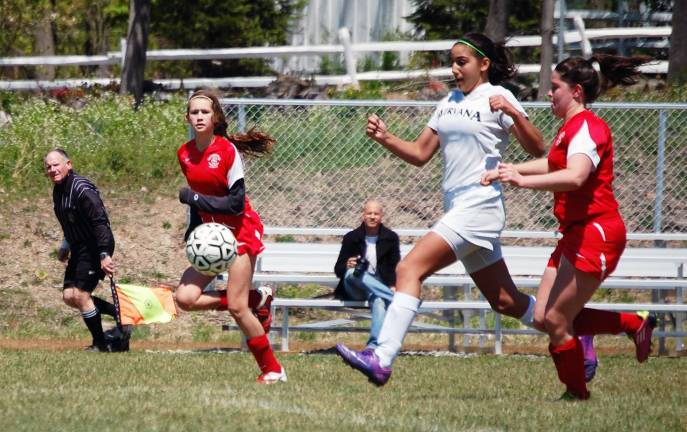 Photo by Pam Walker Victoria DiMarco (in white) breaks away to score the winning goal for the Nirvana Legacy Girls under-14 soccer team against the Rockville Centre Racers.