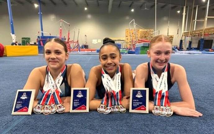 Three gymnasts from Paradigm Athletic Center Gymnastics Team qualified for prestigious national programs. Picture left to right: Avie Frankl, Zoe Santiago and Emily Walsh.
