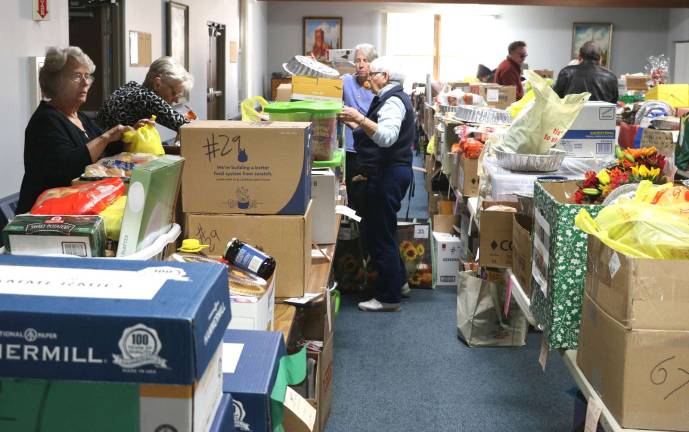 On Tuesday, Nov. 21, approximately 50 volunteers for the Warwick Ecumenical Council Food Pantry collected and distributed more than 200 Thanksgiving Day Food Baskets at the Warwick United Methodist Church.
