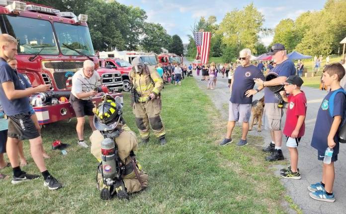 Firefighters give a demonstration at ‘National Night Out’ in Warwick.