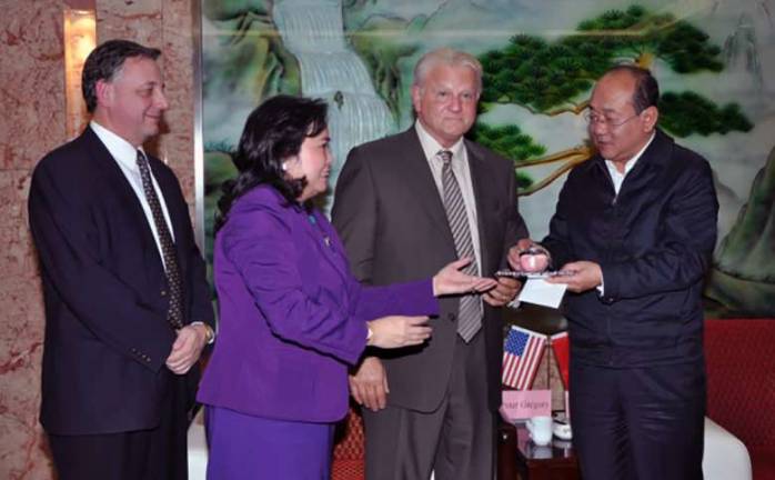 Provided photo The Valley Fresh Direct delegation of Peter Gregory, Winnie Greco and Irv Zuckerman presented Shanyin Mayor Nan with a crystal apple as a token of friendship from its sister-city Warwick and Town Supervisor Michael Sweeton.