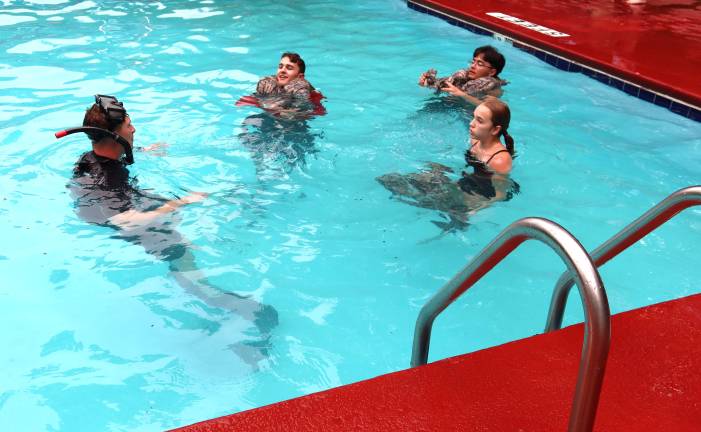 Cadets from S.S. Seward’s JROTC program practice drownproofing, or staying afloat in water with minimum effort by using their own natural buoyancy.