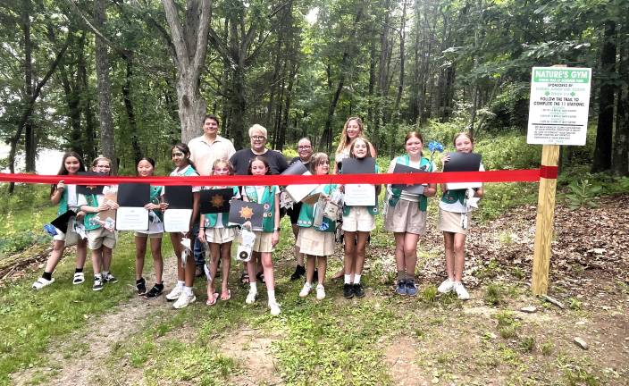 Members of Troop #514 celebrate the opening of community exercise stations at Glenmere Lake Park.