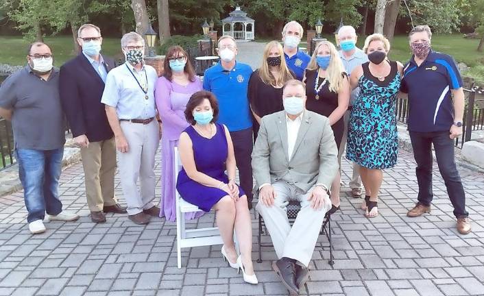 Incoming president Edward M. Lynch, seated right, is flanked by the 2020-2021 Warwick Valley Rotary Board. Outgoing president Tina Buck is seated left. Installation dinner was June 24 at Chateau Hathorn in Warwick. Photo provided by Chris Olert.