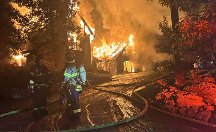 Firefighters battle massive house fire on Rock Ridge Road in Chester on the evening of Tuesday, Aug. 25.