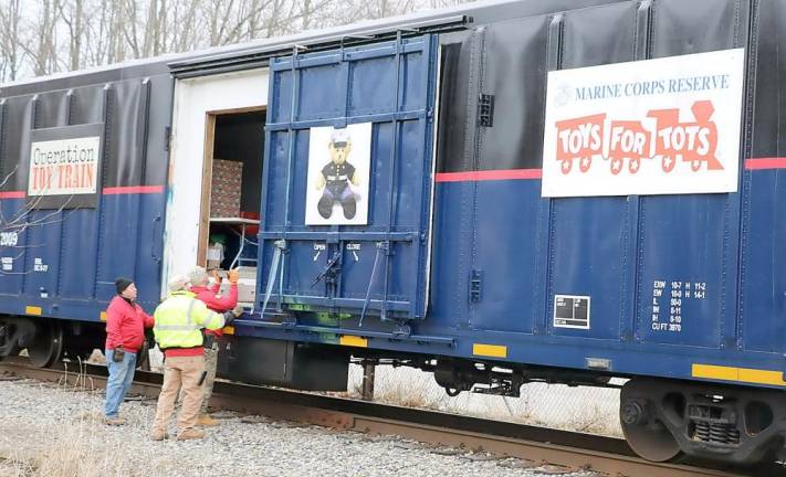 At each stop volunteers help load the train with gifts that have been collected locally by organizations and individuals in each community since October.