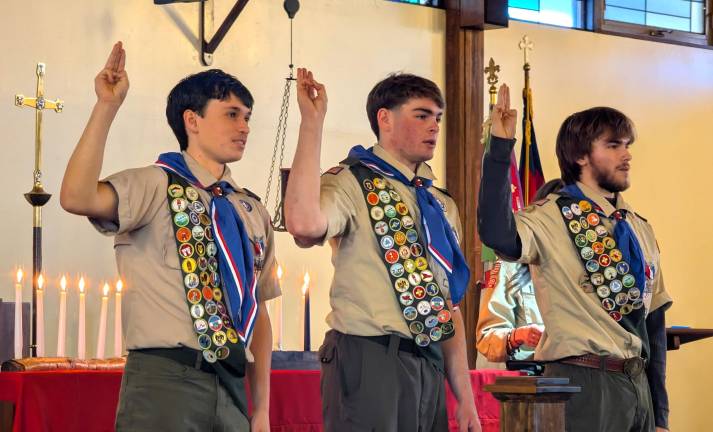 L-R: Eugene Cummings III, Kyle Bolich and Alexander Rodrigues receive prestigious rank of Eagle Scout.