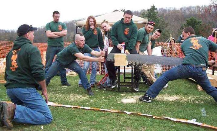 Alfred State&iacute;s Pioneer Woodsmen&iacute;s Team recently hosted the second-annual Pioneer Games on the Alfred campus, and brought home a first-place victory overall with one of its four teams. Pictured are some of the Alfred entrants (left to right): Team Adviser Scott Bingham, Mark Poliey, Nick Wall, Amanda Hoiles, Natasha Talbot, Billy Vannostrand, Paul Glover, Spencer Sagneri and Joe Francese.