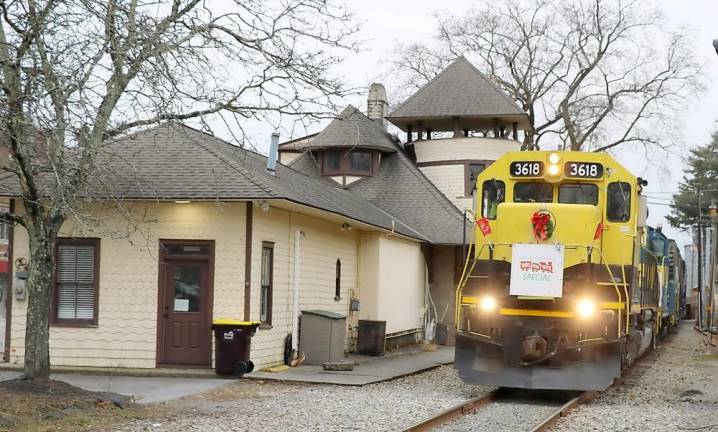 The Middletown &amp; New Jersey Railroad’s Toys for Tots train, pictured passing Warwic's historic railroad station, was on a journey that originated in Warwick with stops at Sugar Loaf, Middletown, Cambell Hall and Montgomery.