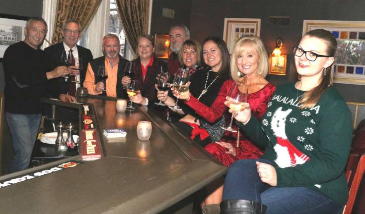Photo by Roger Gavan Gathered in front of the bar at The Warwick Inn to finalize details for the Warwick Valley Chamber of Commerce holiday mixer on Dec. 5 are, from left, Warwick Inn owner Alberto Dautaj, Warwick Valley Chamber of Commerce Executive Director Michael Johndrow, board member James Mezzetti, chamber office manager Sarah Armand, Vice President John Redman, President Mechelle Casciotta, board member Kristen Weiss, programs chair Janine Dethmers, and office assistant Bea Arner.
