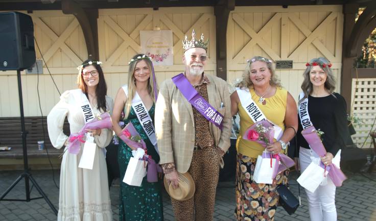Tim Mullaly, 2026 Queen for a Day, surrounded by members of the royal court.