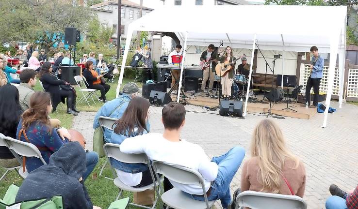 Visitors enjpy all day entertainment on Railroad Green and throughout the village.