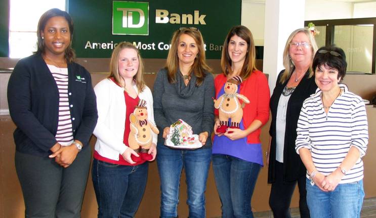 Photo by Roger Gavan The Warwick Merchant Guild is starting a new tradition this year with their first annual gingerbread contest during the celebration of Home for the Holidays. Local residents are invited to have their creations displayed at TD Bank on 51 Main St. From left, TD Bank Assistant Branch Manager Heather Davis, volunteer Tarin Hackbarth, Gingerbread House Contest coordinator Nicole Repose, volunteer Christina Hohmann and Home for the Holiday&#xed;s co-Chairs Debbie Iurato and Mary Beth Schlichting.