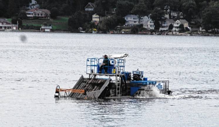 One of the Lake Hopatcong harvesters approaches the launch at Nolan’s Point. (Photos by Jane Primerano)