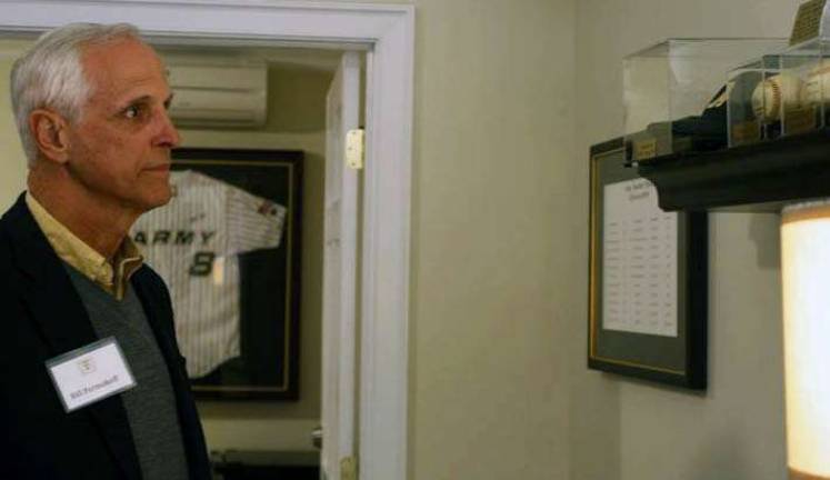 Former Army Baseball Coach Bill Permakoff looks at baseball items on display in the newly dedicated Army Baseball Room at the Historic Thayer Hotel at West Point.