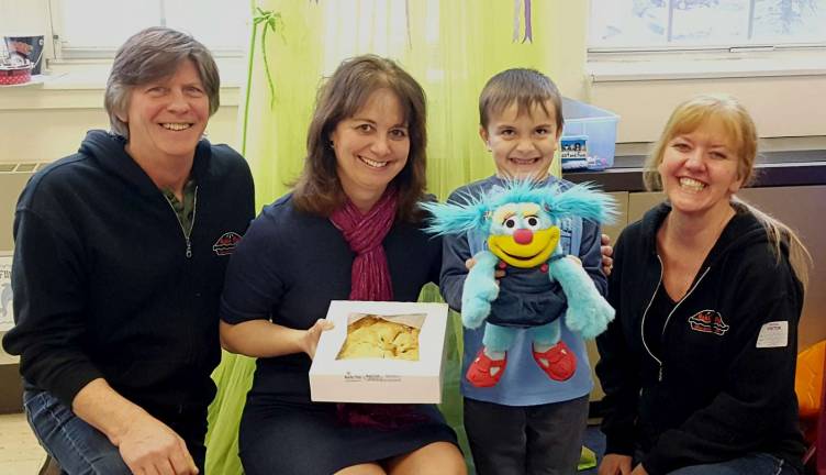 Photos provided by Vanessa Holland Pictured from left to right are: Tom Herman, Noble Pie co-owner; Park Avenue Elementary School teacher; student Ellis Dickerson, who nominated his teacher for the award; and Leslie Noble, co-owner of Noble Pies.